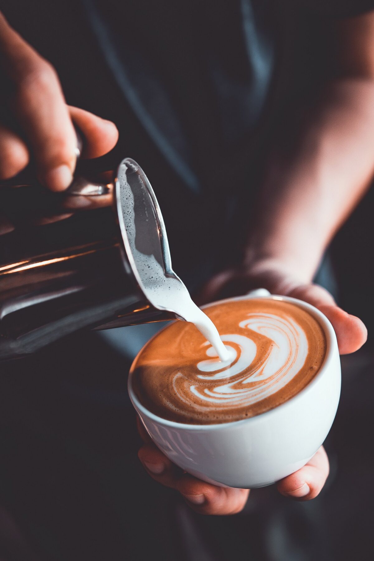 person pouring coffee